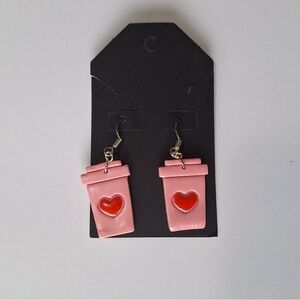 Coffee cup with love earrings.
